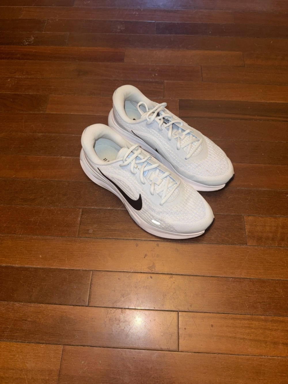 Nike White Mesh Running Shoes with Black Swoosh